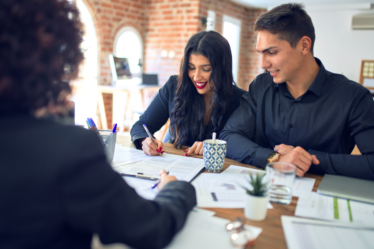 Young beautiful couple applying mortgage